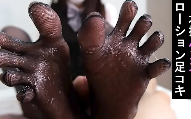 On the couch with a pantyhose-clad cutie giving a slippery foot job after work