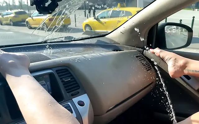 MILF squirts a river in the car in 4K