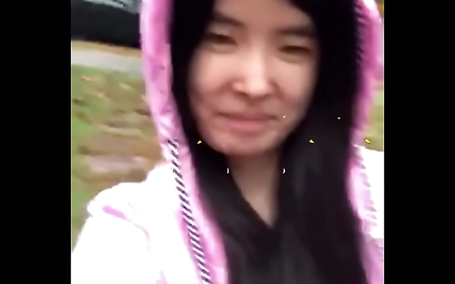 Wild Asian teen exposed in the rain outdoors