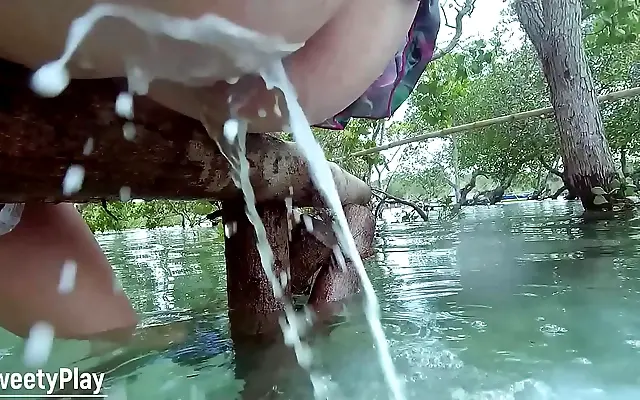 Pushing out strong anal milk enema outdoors in the park