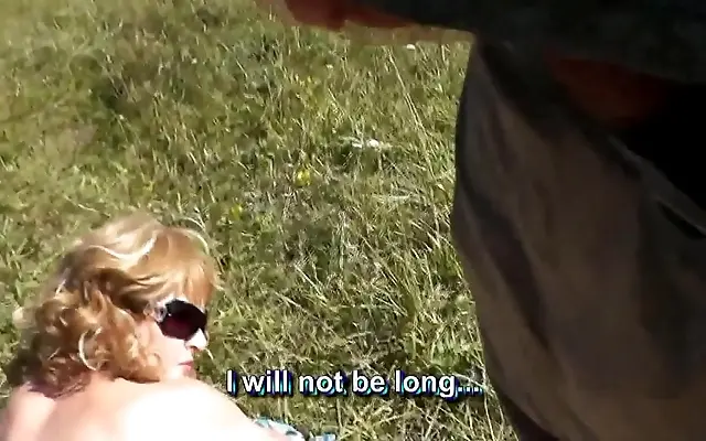 Electric tension on a secluded beach as a sexy blonde sunbathes and a man can't resist