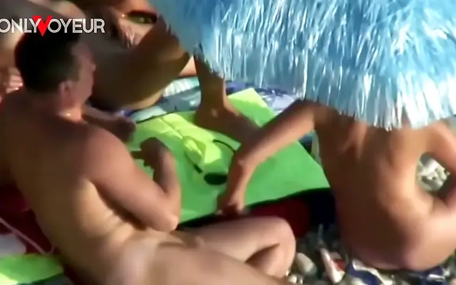 Beachside Threesome Unfolds in Sunlit Swinger Camp with Tanned Passion