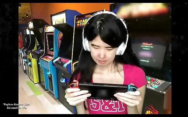 Frenzied topless Asian gamer babe dominates Nintendo session