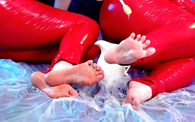 In the latex dungeon FetishAurae and Arya indulge in sweet sticky foot worship