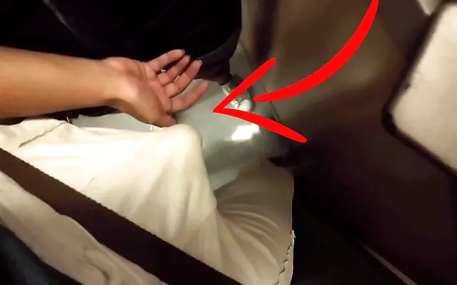 Blonde MILF gives a hidden handjob on a packed subway train