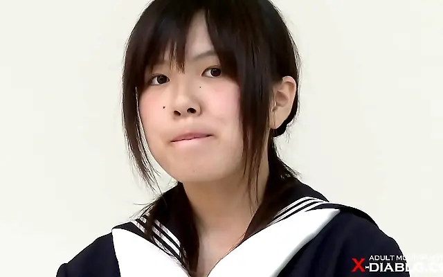 Unhurried tease as she sheds her sailor uniform for a steamy first nude shoot